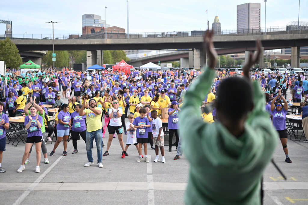 Teams gather to participate in the Zumba warm up at Infinite Legacy's annual Donate Life Family Fun Run.